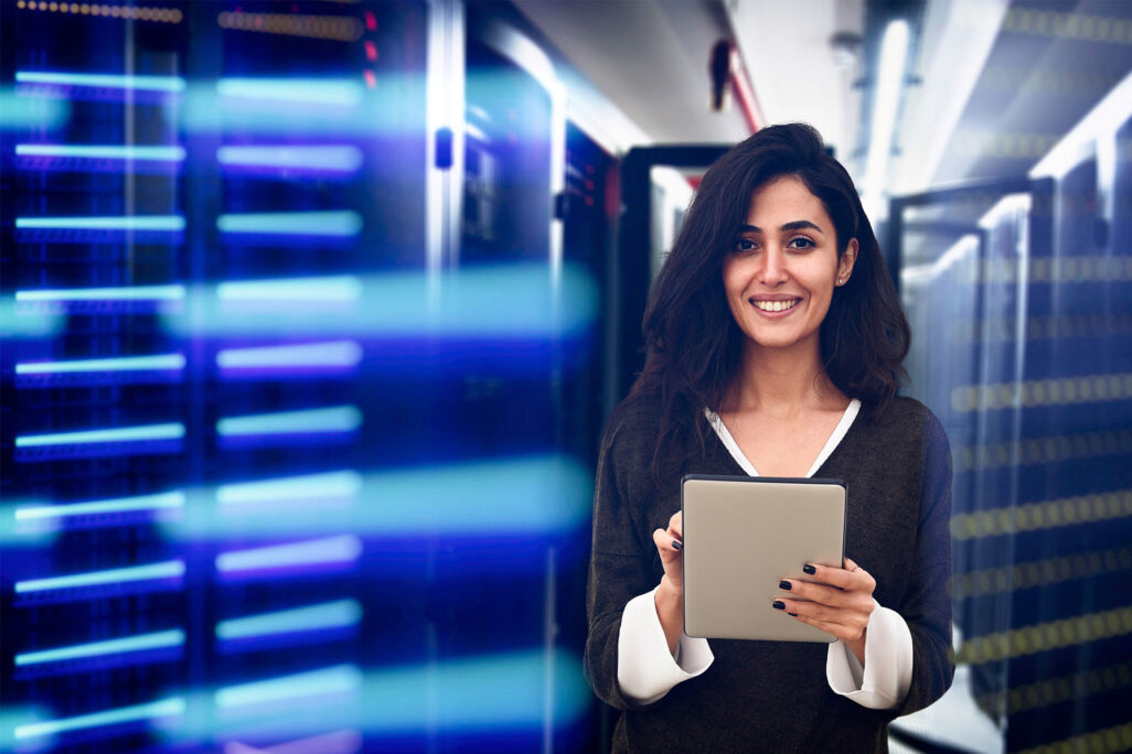 Woman standing in a room of servers